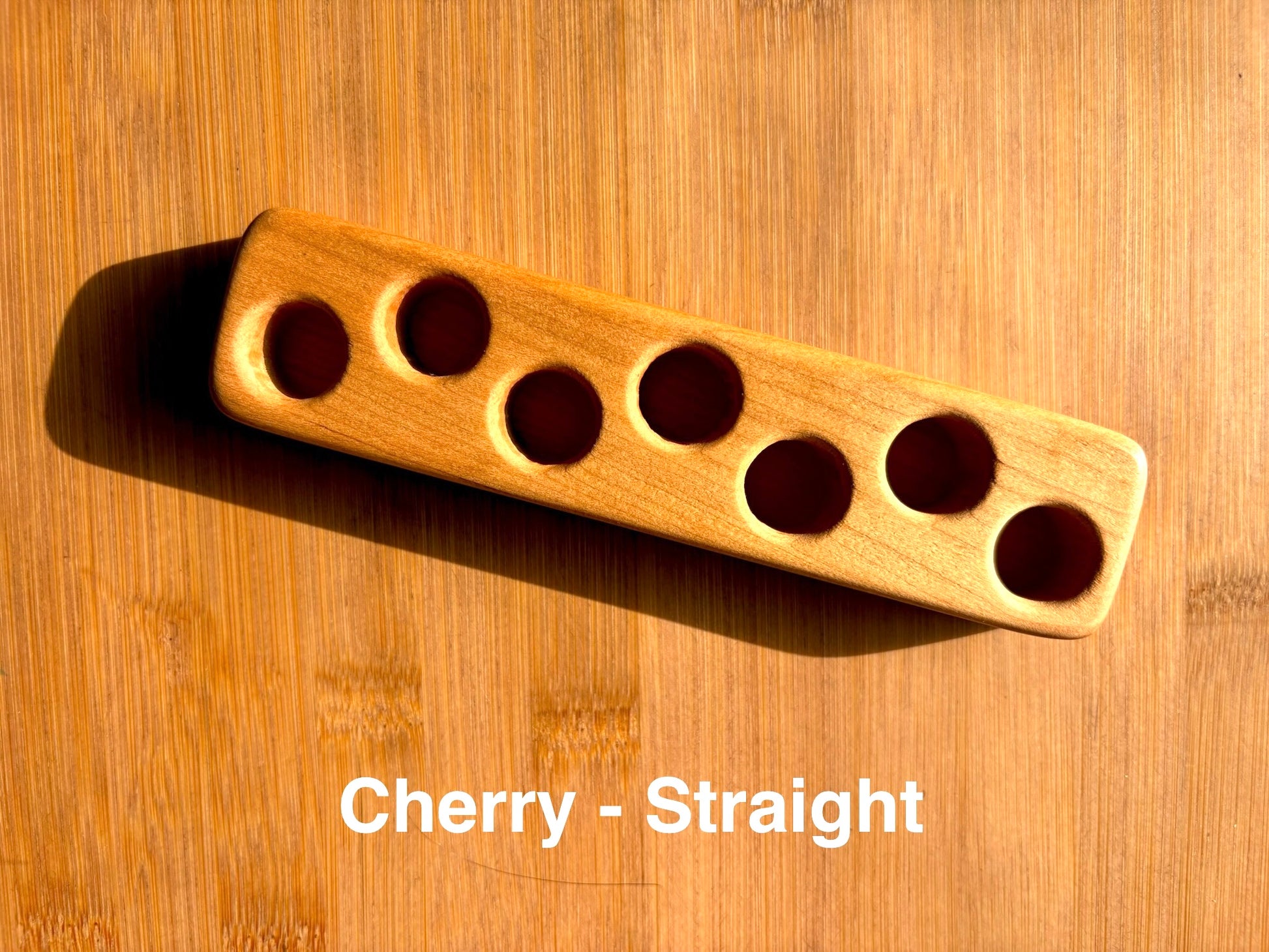 Straight-base cherry wood ink sample vial holder with smooth, bright, and warm finish.