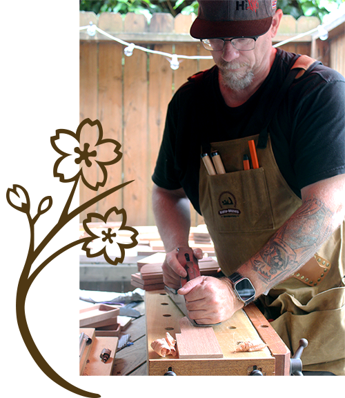 Nagomi Woodworking founder handcrafting a natural wood desktop organizer in his workshop, reflecting care, balance, and craftsmanship