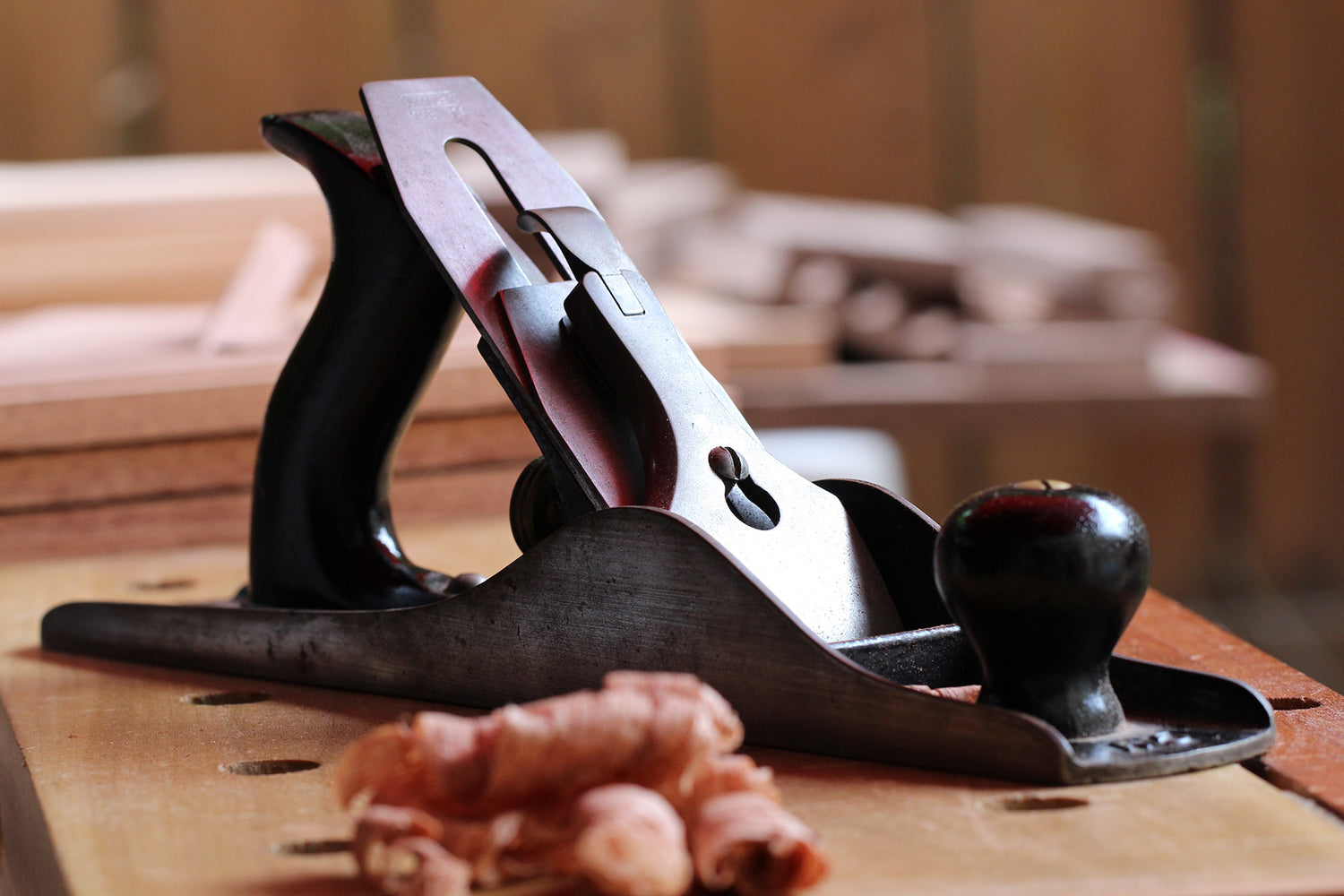 Wood hand plane on a workbench, reflecting Nagomi’s design values of harmony and craftsmanship
