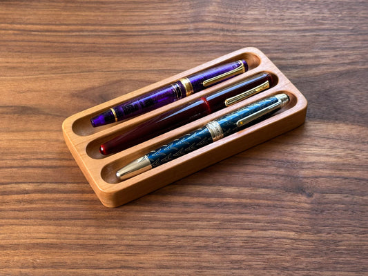 Front view of the Shizuku 3-slot pen tray handcrafted from walnut, designed for displaying fountain pens.